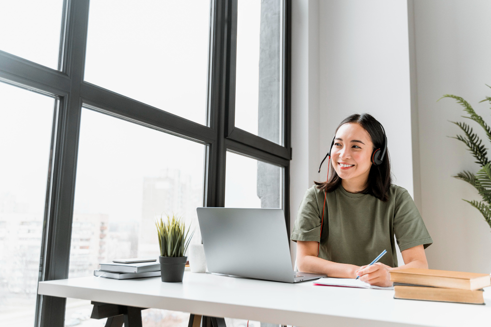 woman-with-headset-having-video-call-laptop